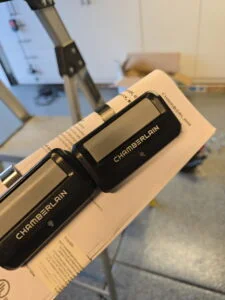 Long Beach garage door repair technician checking spring tension and door balance inside a residential garage