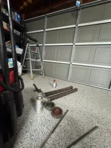 Garage door repair technician inspecting a residential garage door in Long Beach CA