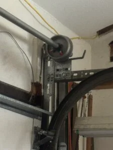 Long Beach garage door repair service showing opener, spring, cable, and track inspection