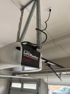 Garage door opener straining because of a broken spring on a Long Beach home garage door