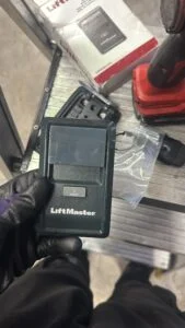 Residential garage door opener and top panel inspection before garage door spring replacement in Long Beach CA